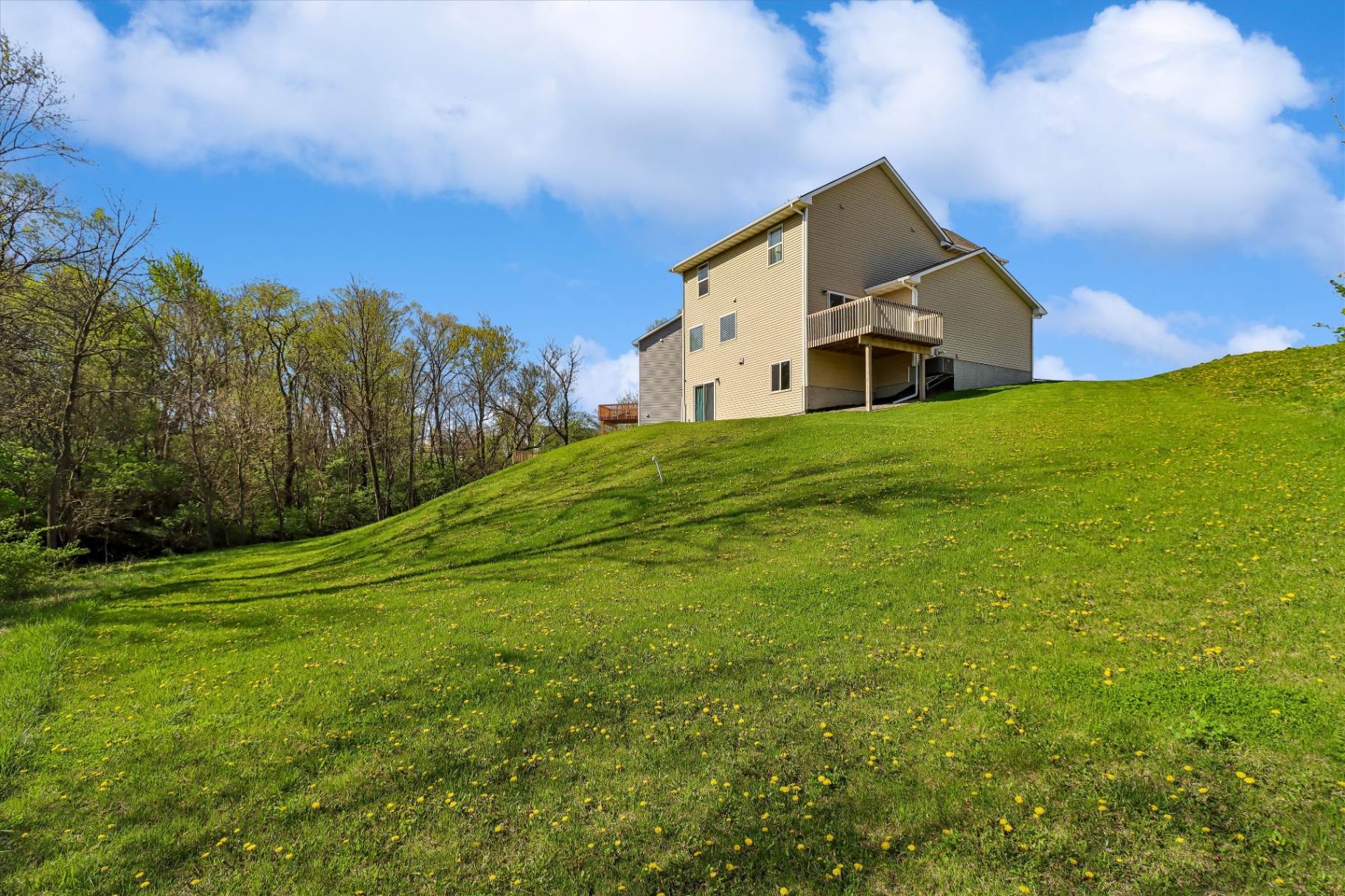 Rear elevation perched on the hill above the tree line