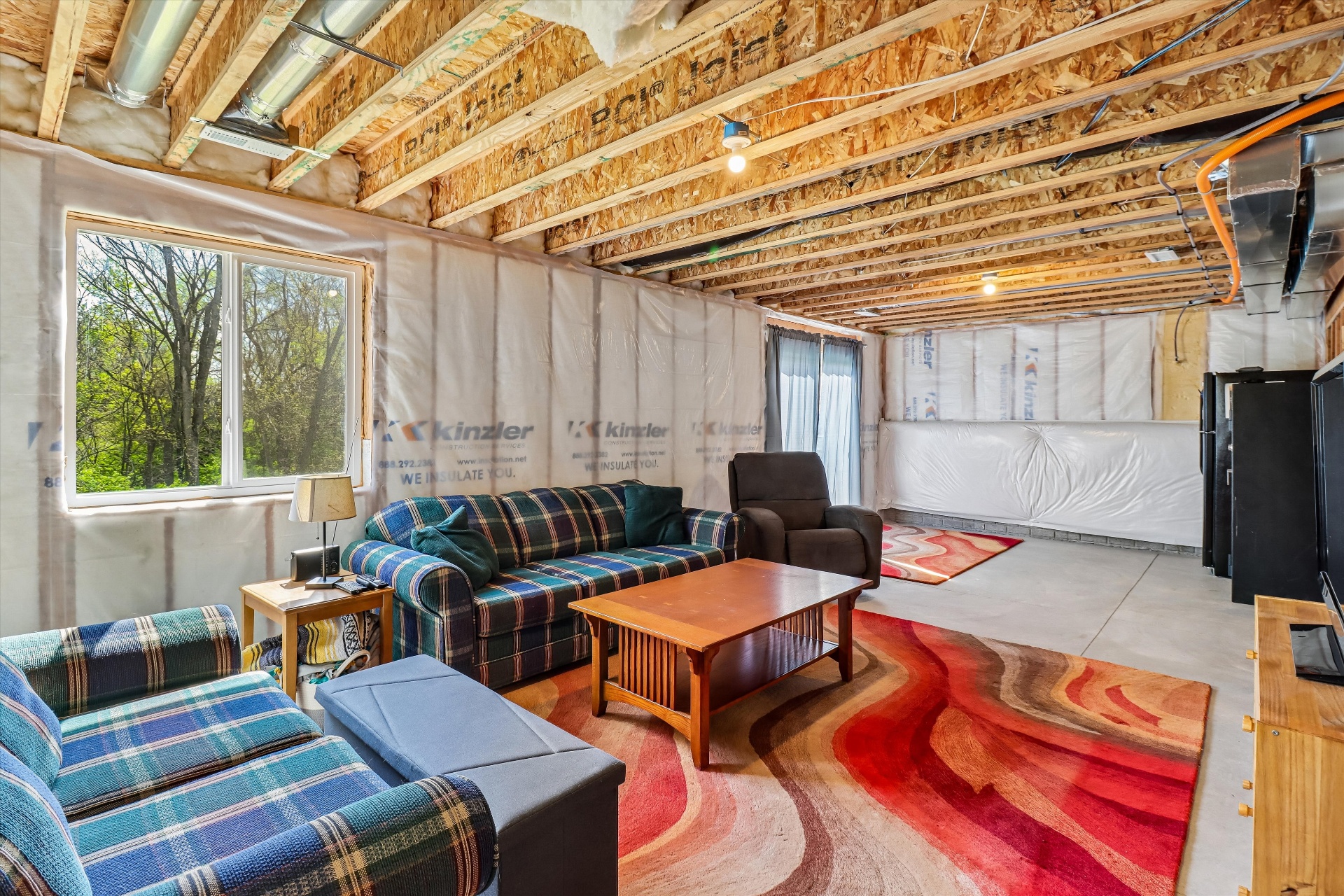 Basement lounge area — already wired, already livable, ready to finish your way