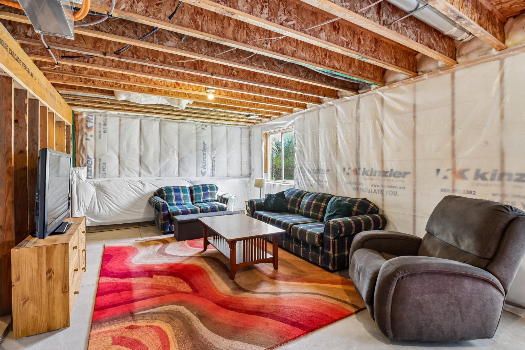 Unfinished basement already in use as extra living space with room to expand