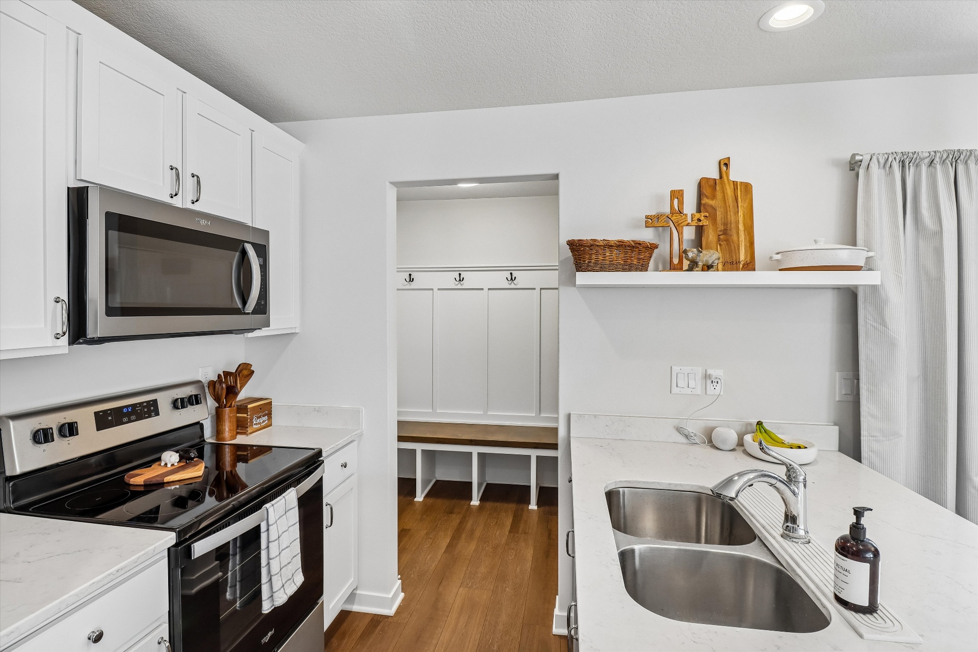 Kitchen sightline to the custom mudroom built-ins